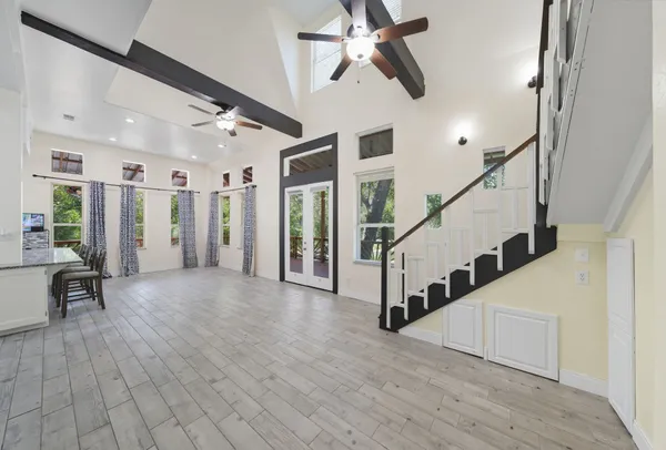 a view of entryway and hall with wooden floor