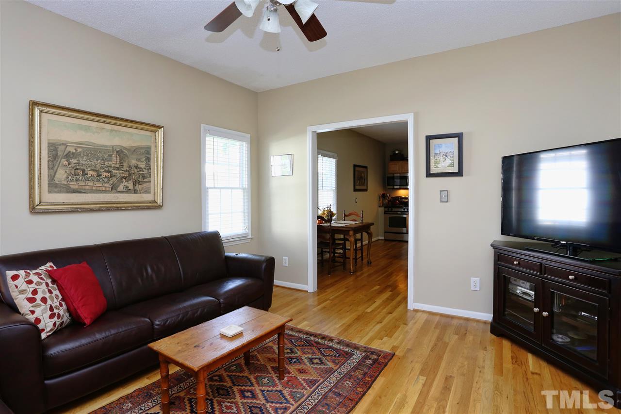 316 Cooke Street Raleigh, NC 27601 - Photo 6 of 23 a living room with furniture and a flat screen tv