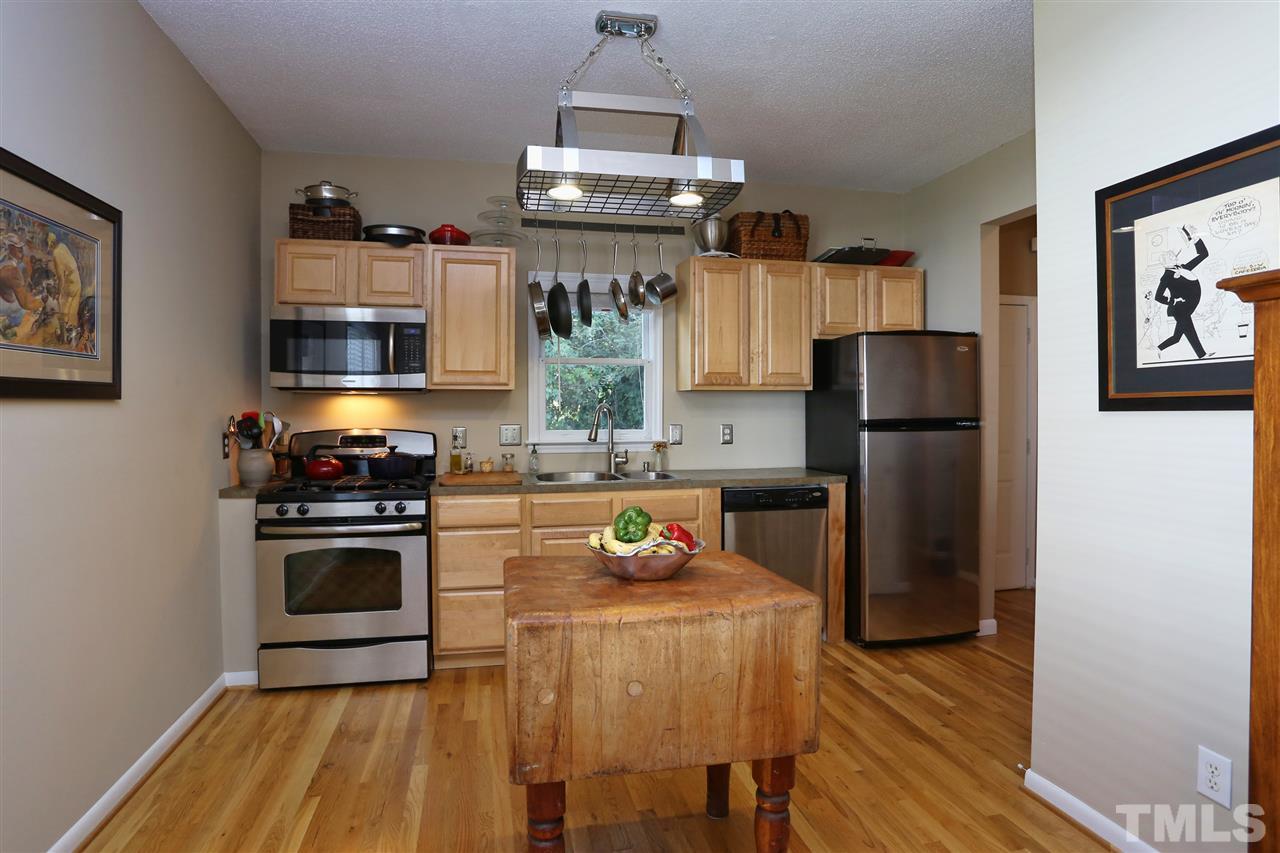 316 Cooke Street Raleigh, NC 27601 - Photo 8 of 23 a kitchen with stainless steel appliances granite countertop a refrigerator stove top oven and sink
