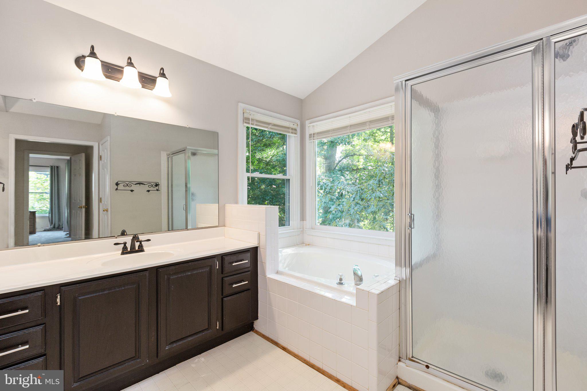 9807 Poplar Forest Road Fredericksburg, VA 22408 - Photo 22 of 53 Soaking tub and glass enclosed shower
