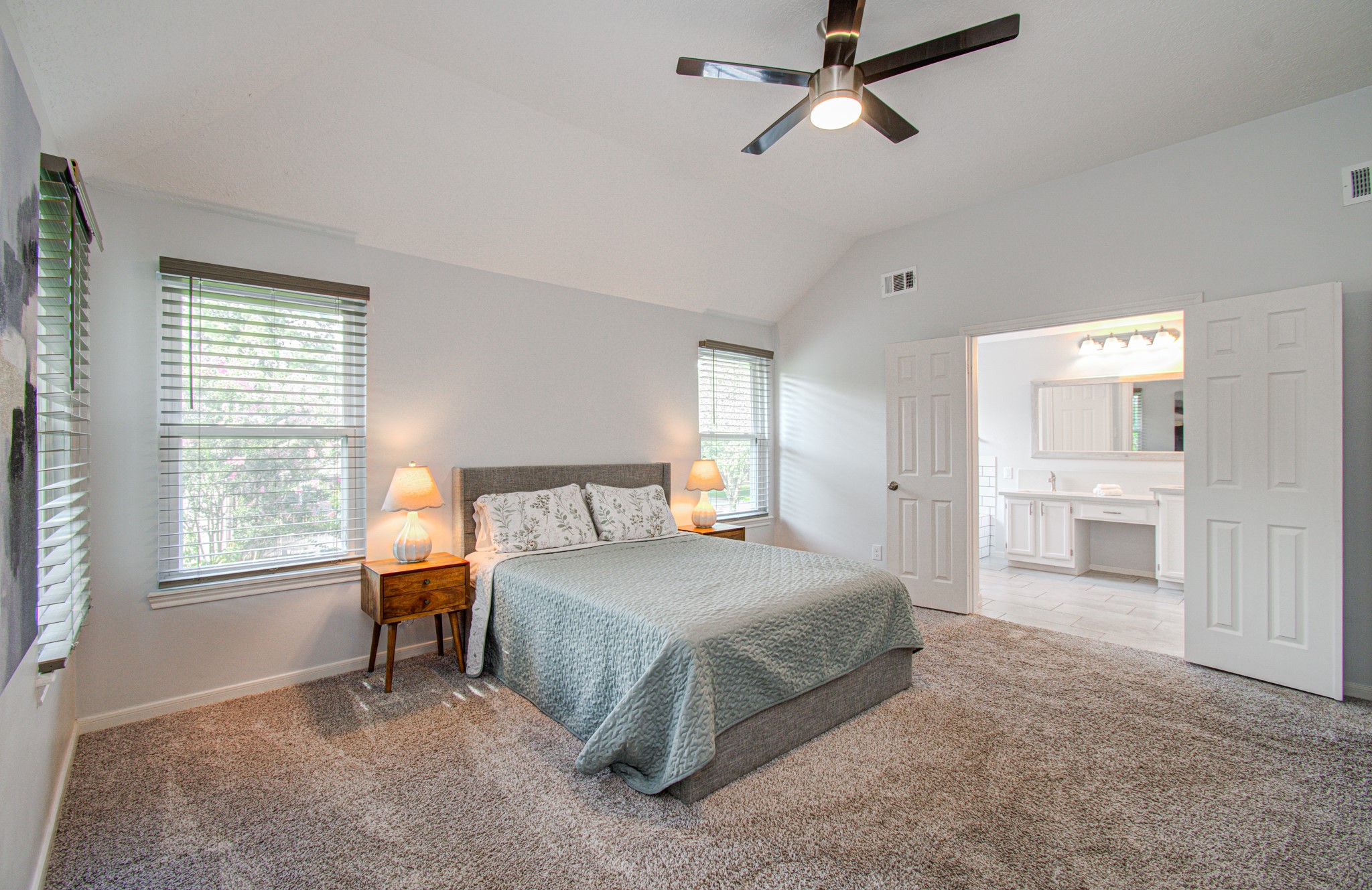 22927 Northoak Forest Lane Spring, TX 77389 - Photo 16 of 37 a bedroom with a bed a dresser and a window