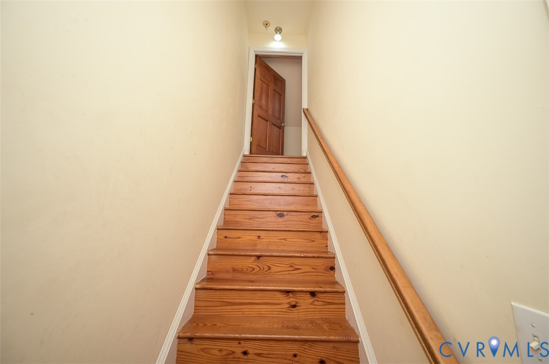 6040 Hare Road Henrico, VA 23231 - Photo 33 of 54 Pine wood staircase with a natural wood handrail,