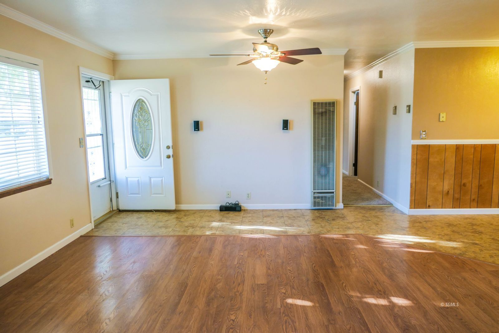 812 South Sunset Street Ridgecrest, CA 93555 - Photo 6 of 40 a view of a livingroom with wooden floor and a bathroom