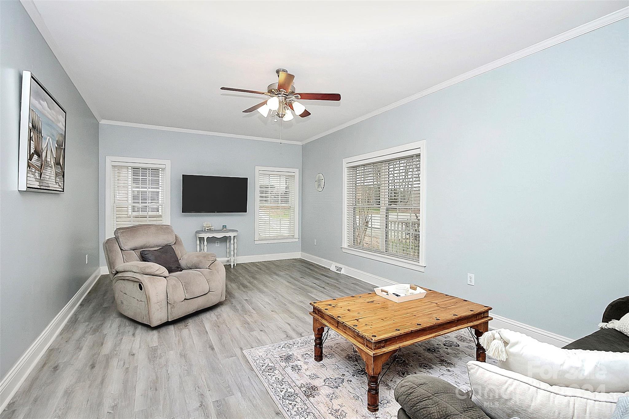 218 Stillwater Road Troutman, NC 28166 - Photo 15 of 43 a living room with furniture and a flat screen tv