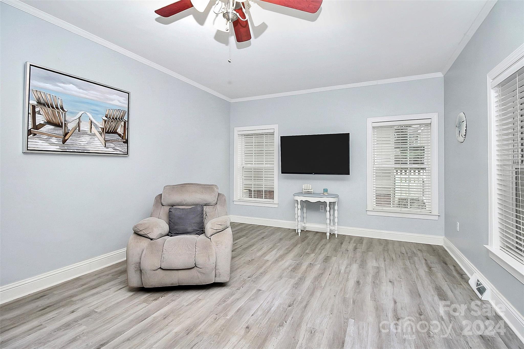 218 Stillwater Road Troutman, NC 28166 - Photo 17 of 43 a living room with furniture and a flat screen tv
