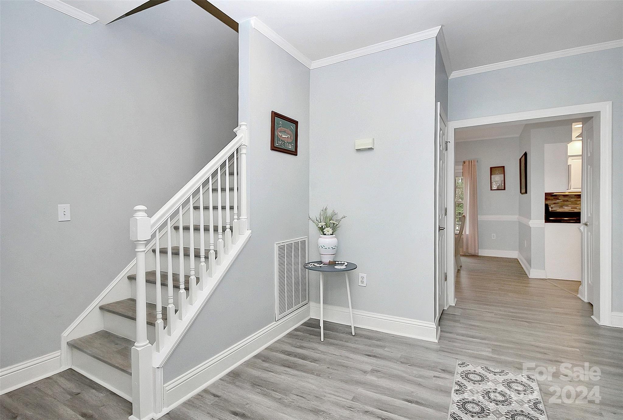 218 Stillwater Road Troutman, NC 28166 - Photo 19 of 43 a view of a hallway with wooden floor and entryway