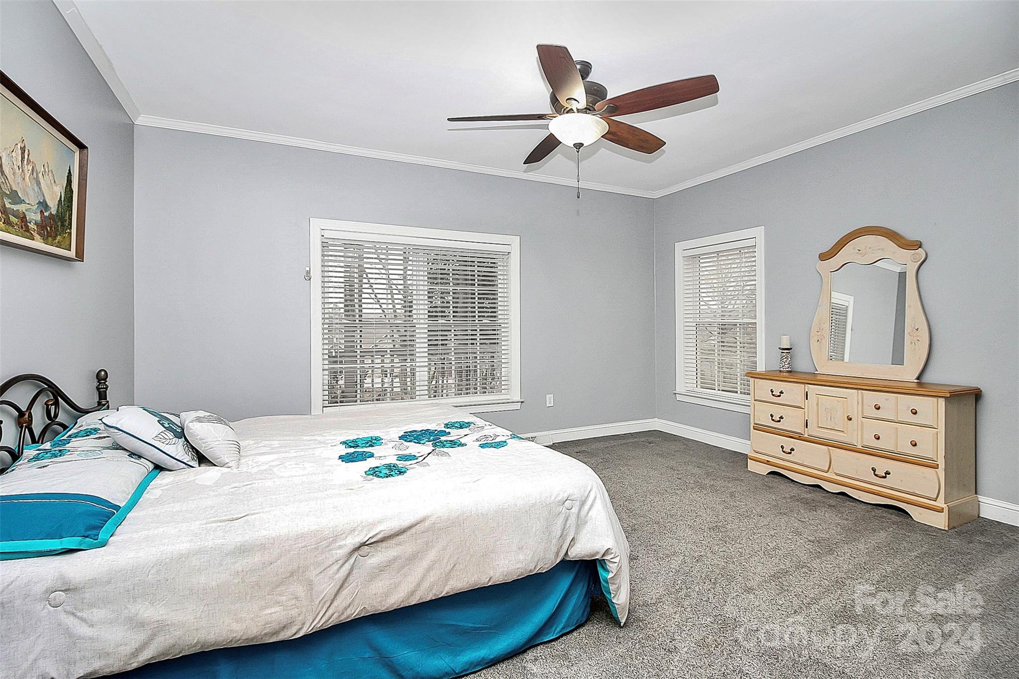 218 Stillwater Road Troutman, NC 28166 - Photo 24 of 43 a bedroom with a bed a window and dresser