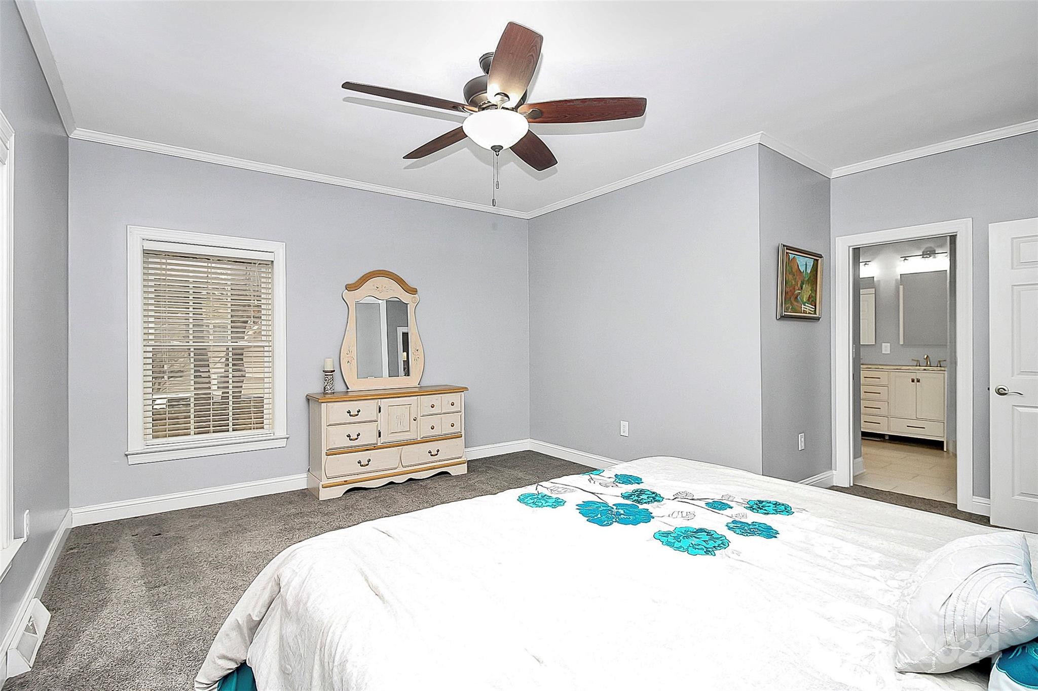 218 Stillwater Road Troutman, NC 28166 - Photo 25 of 43 a bedroom with a bed and wooden floor