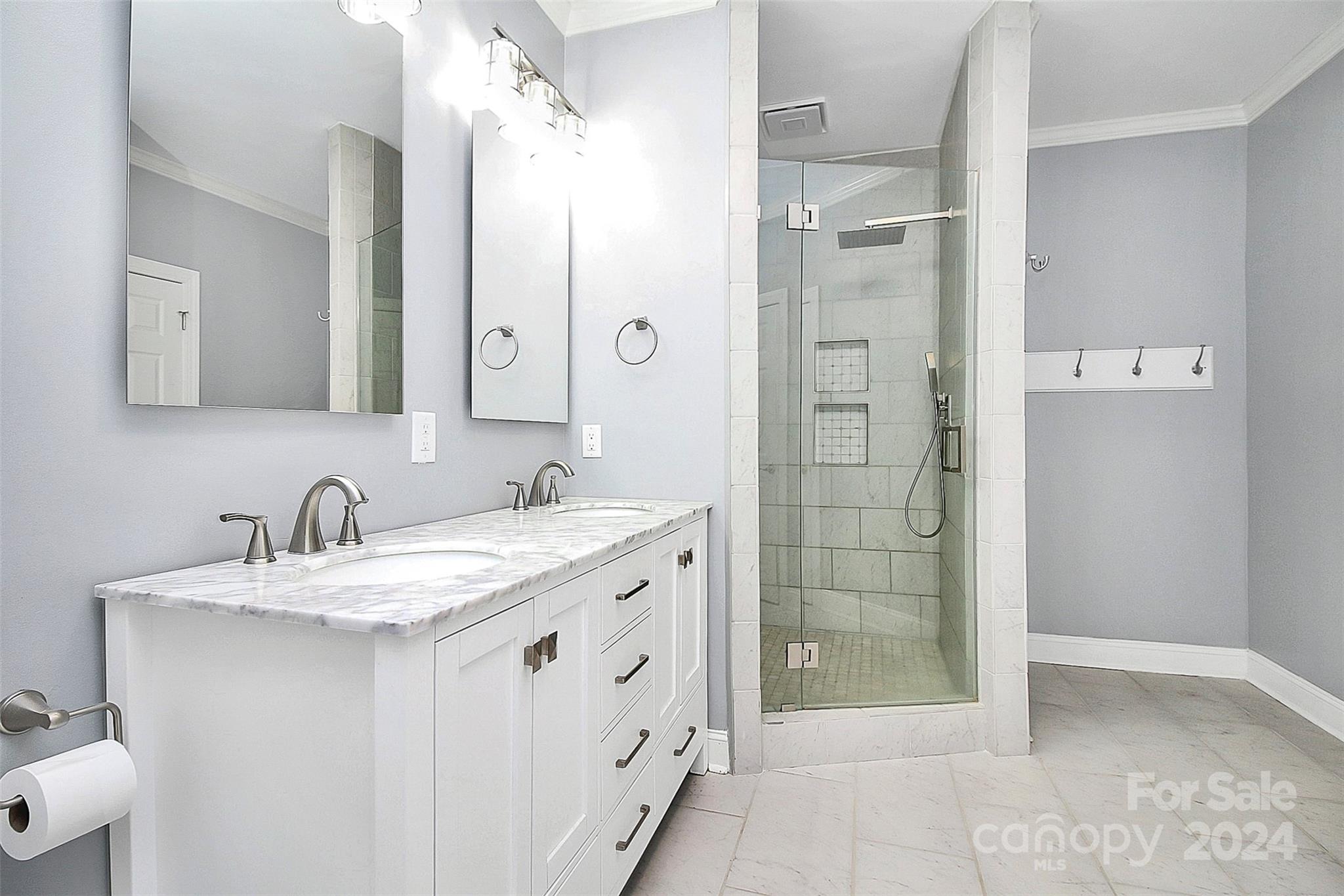 218 Stillwater Road Troutman, NC 28166 - Photo 27 of 43 a bathroom with a granite countertop sink two mirror and shower