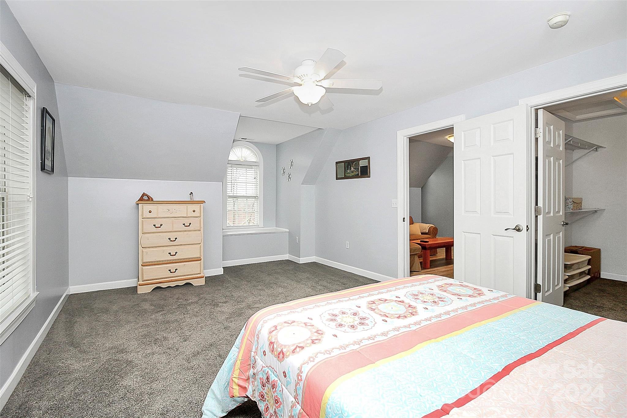218 Stillwater Road Troutman, NC 28166 - Photo 31 of 43 a bedroom with a bed and a television