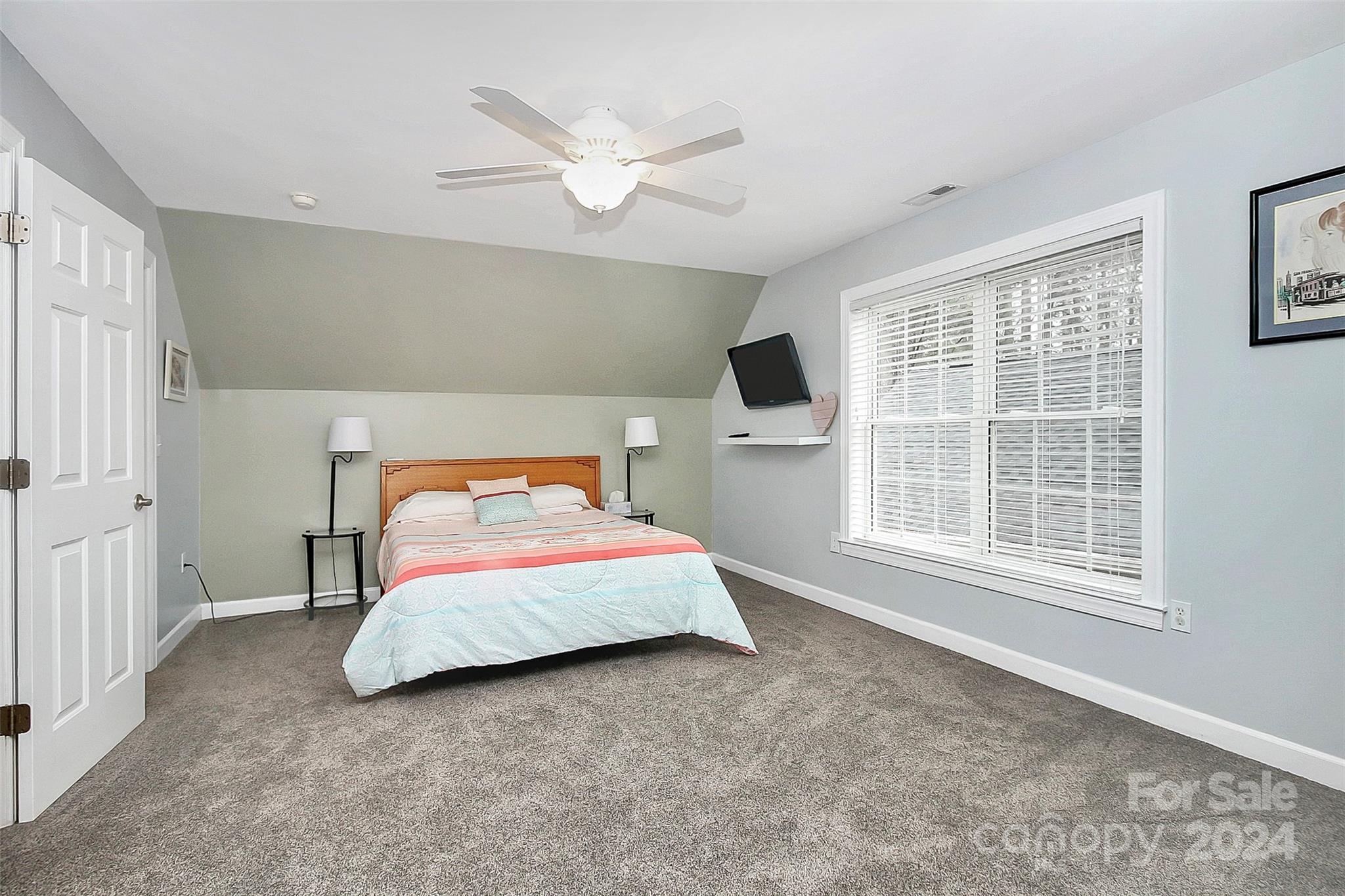 218 Stillwater Road Troutman, NC 28166 - Photo 32 of 43 a bedroom with a bed and a large window