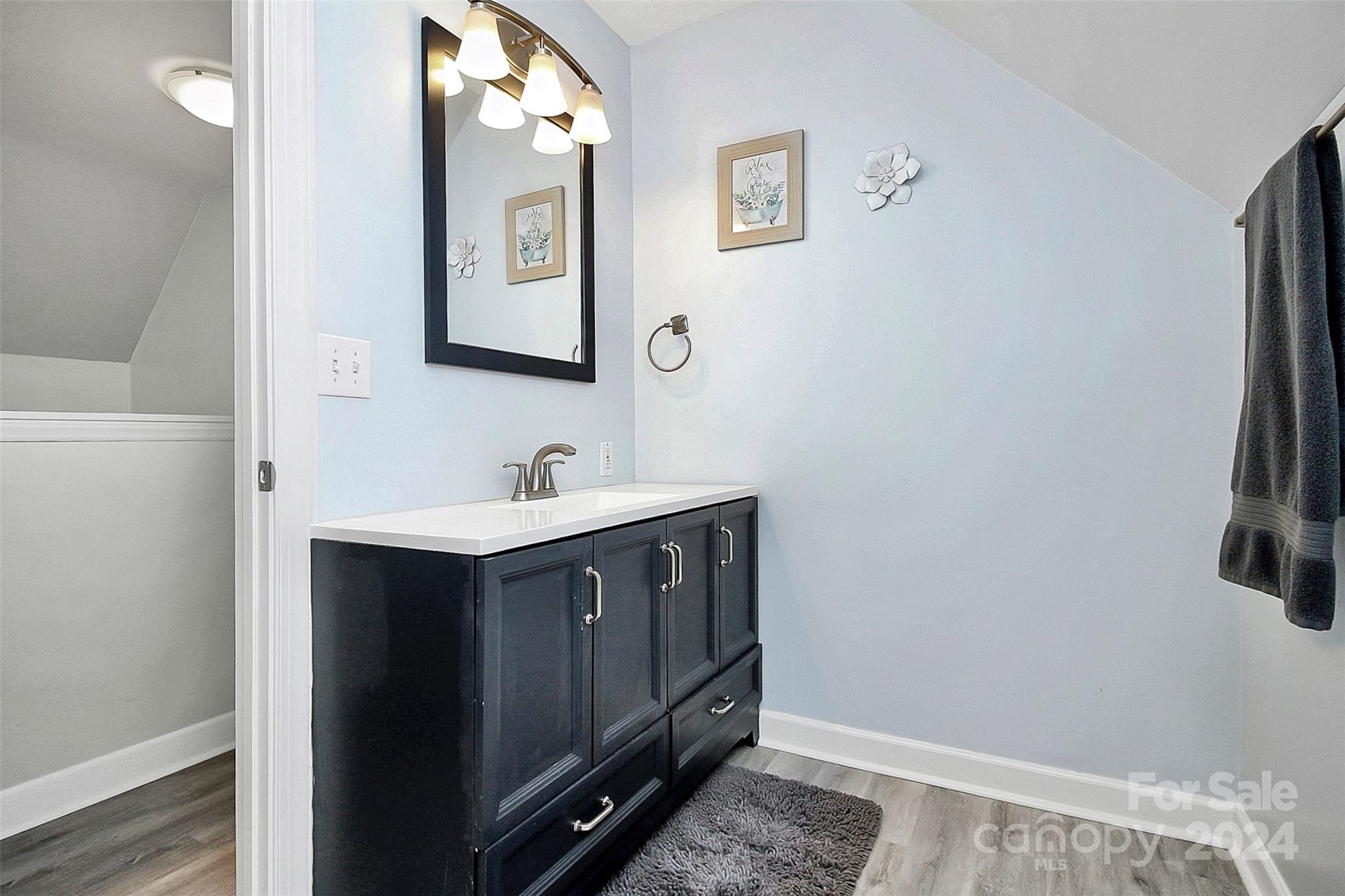 218 Stillwater Road Troutman, NC 28166 - Photo 34 of 43 a bathroom with a sink vanity and mirror