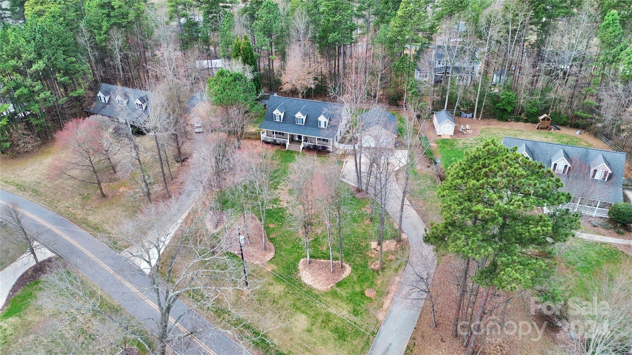 218 Stillwater Road Troutman, NC 28166 - Photo 42 of 43 a aerial view of a house with a yard and garden