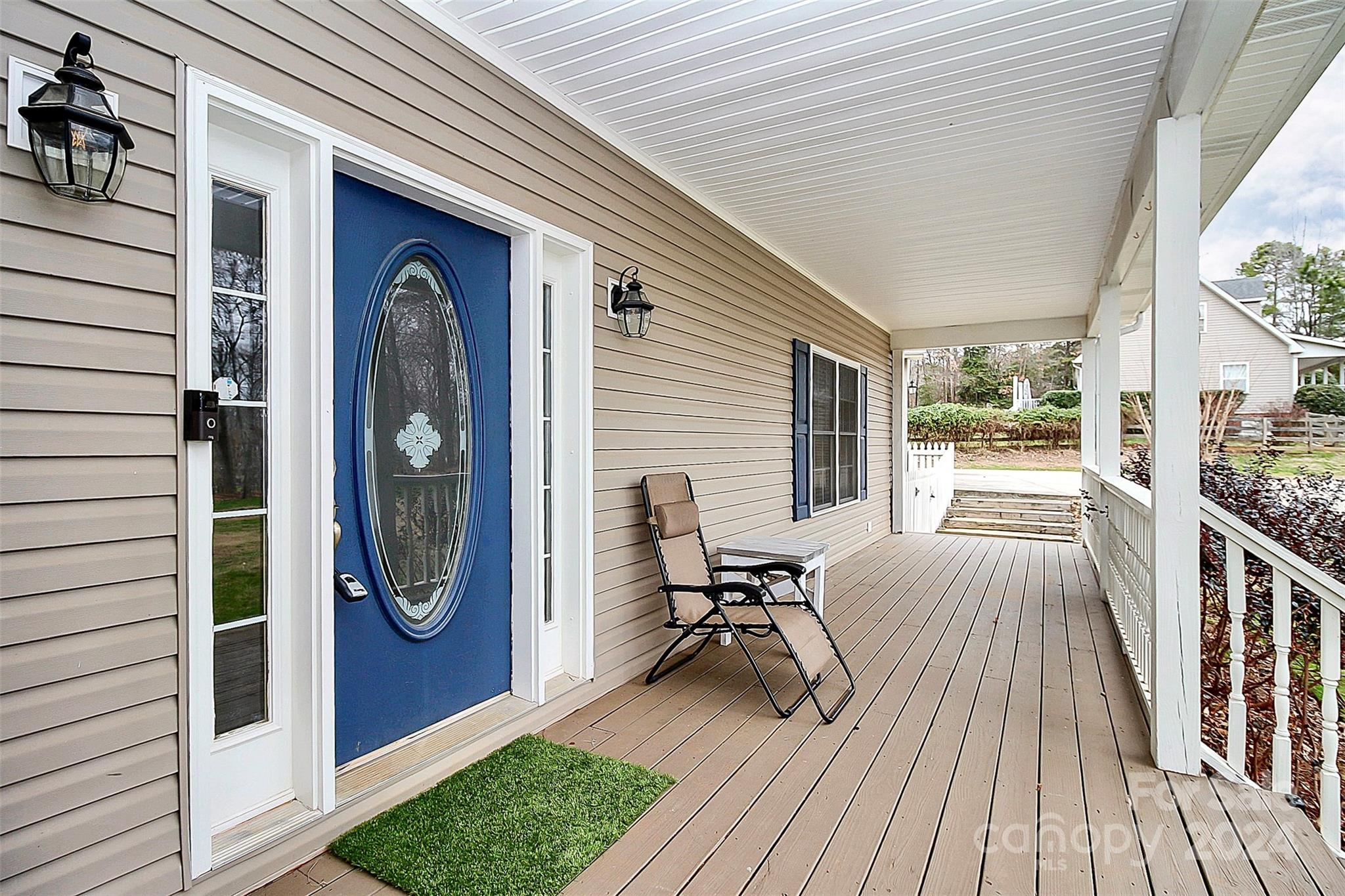 218 Stillwater Road Troutman, NC 28166 - Photo 7 of 43 a view of a deck with wooden floor and furniture