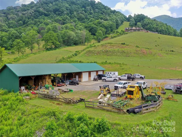 a bathroom with a granite countertop sink and a large mirror