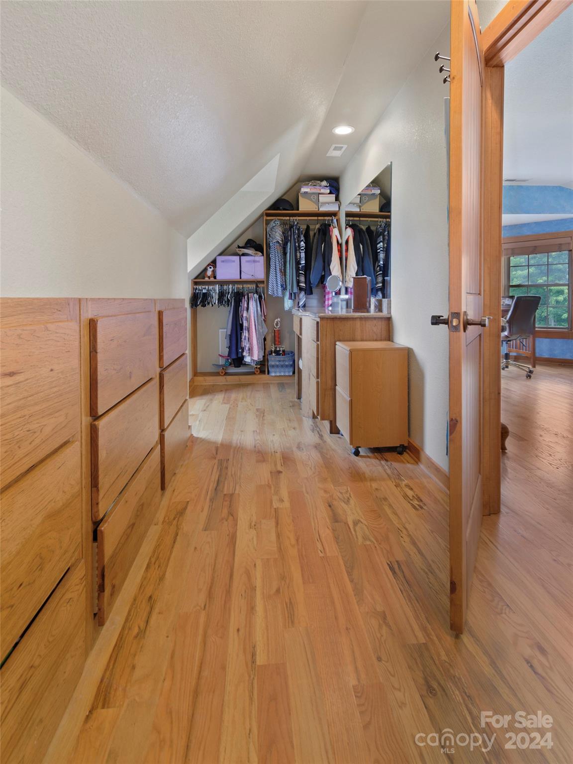 317 Camp Branch Road Clyde, NC 28721 - Photo 29 of 47 a view of a living room and kitchen with furniture wooden floor and window