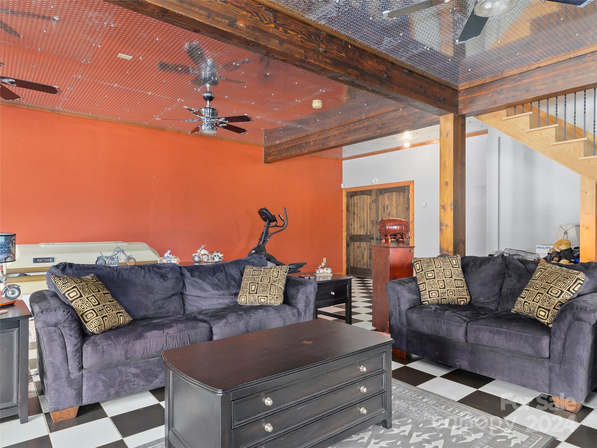 317 Camp Branch Road Clyde, NC 28721 - Photo 31 of 47 a living room with furniture and a flat screen tv