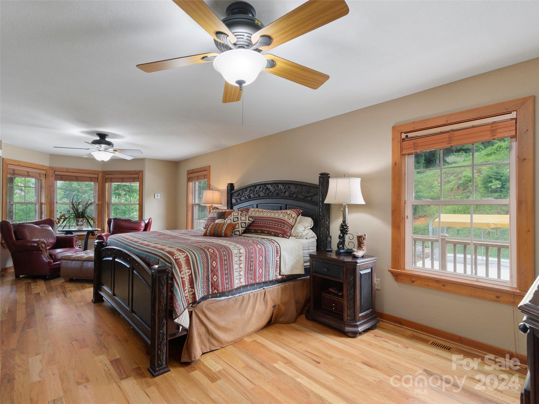 317 Camp Branch Road Clyde, NC 28721 - Photo 40 of 47 a bedroom with a bed and wooden floor