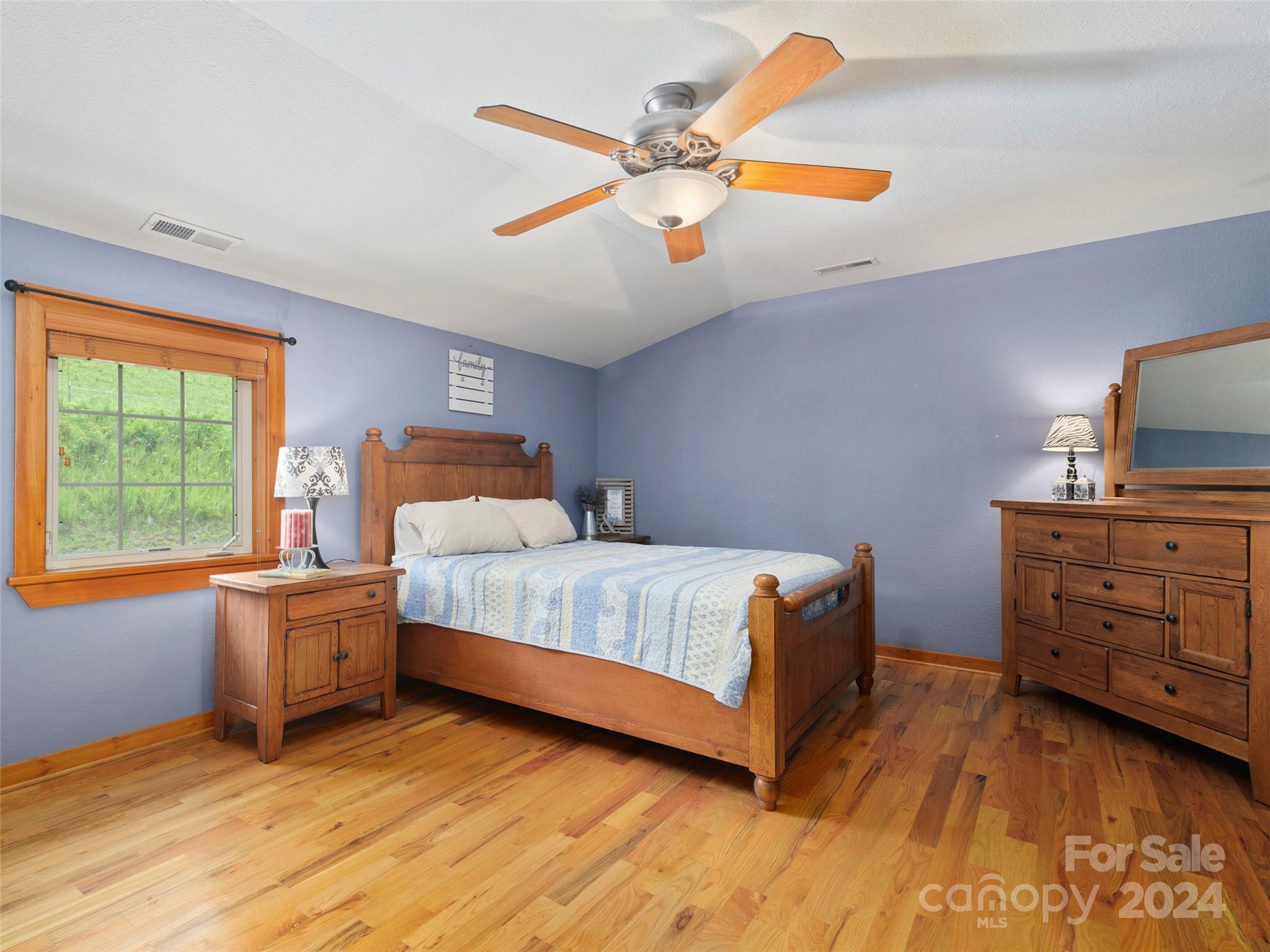 317 Camp Branch Road Clyde, NC 28721 - Photo 43 of 47 a bedroom with a bed and a window