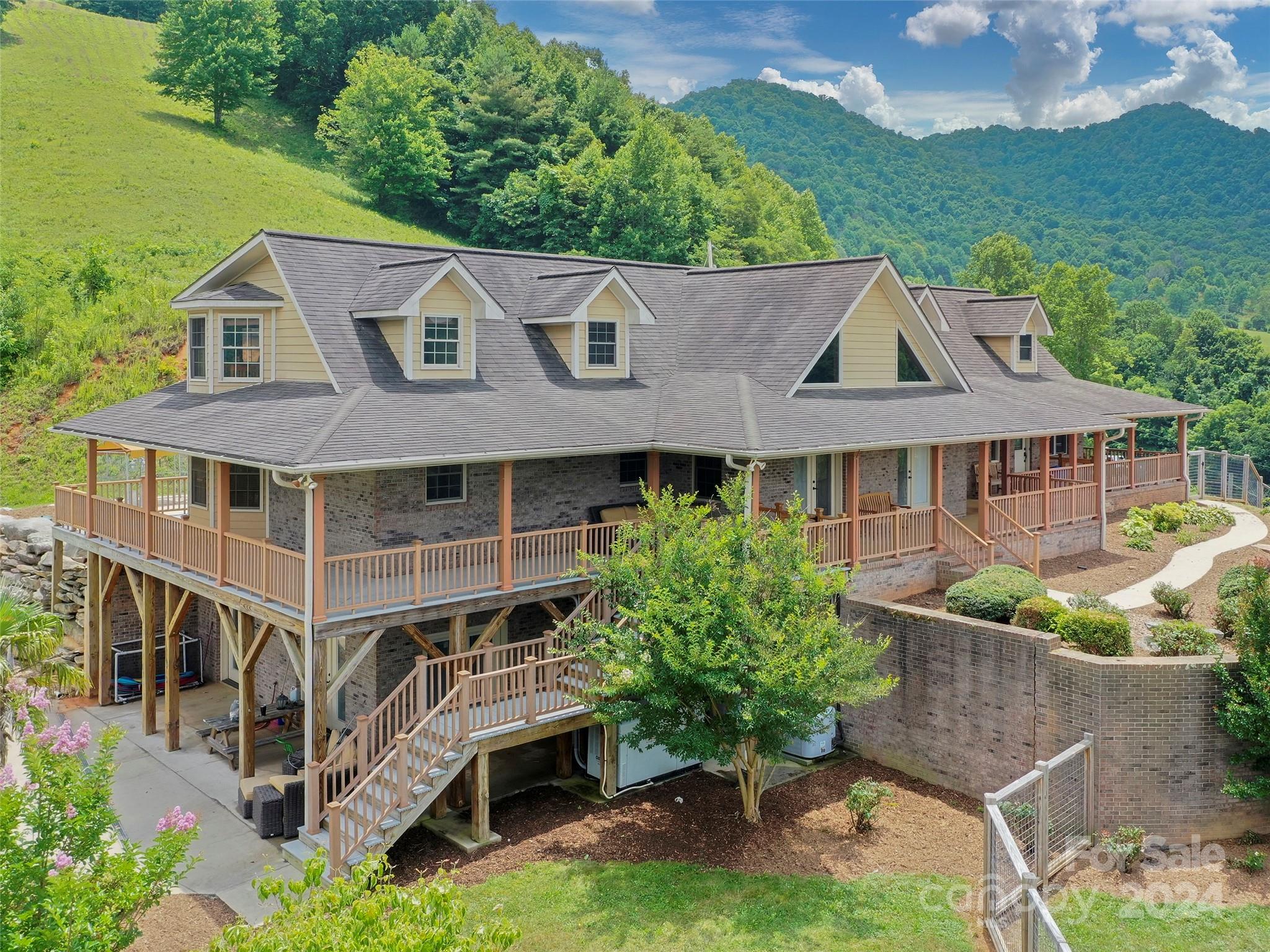317 Camp Branch Road Clyde, NC 28721 - Photo 5 of 47 an aerial view of a house with a yard