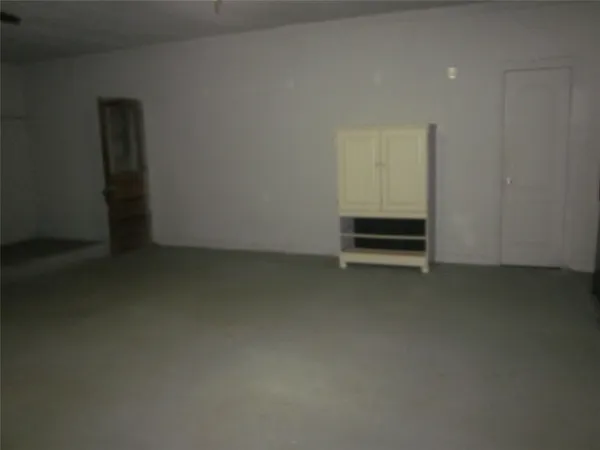 an empty room with a empty space and windows