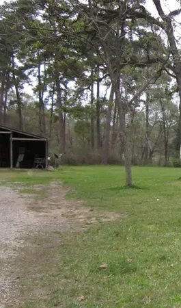 a backyard of a house with lots of green space