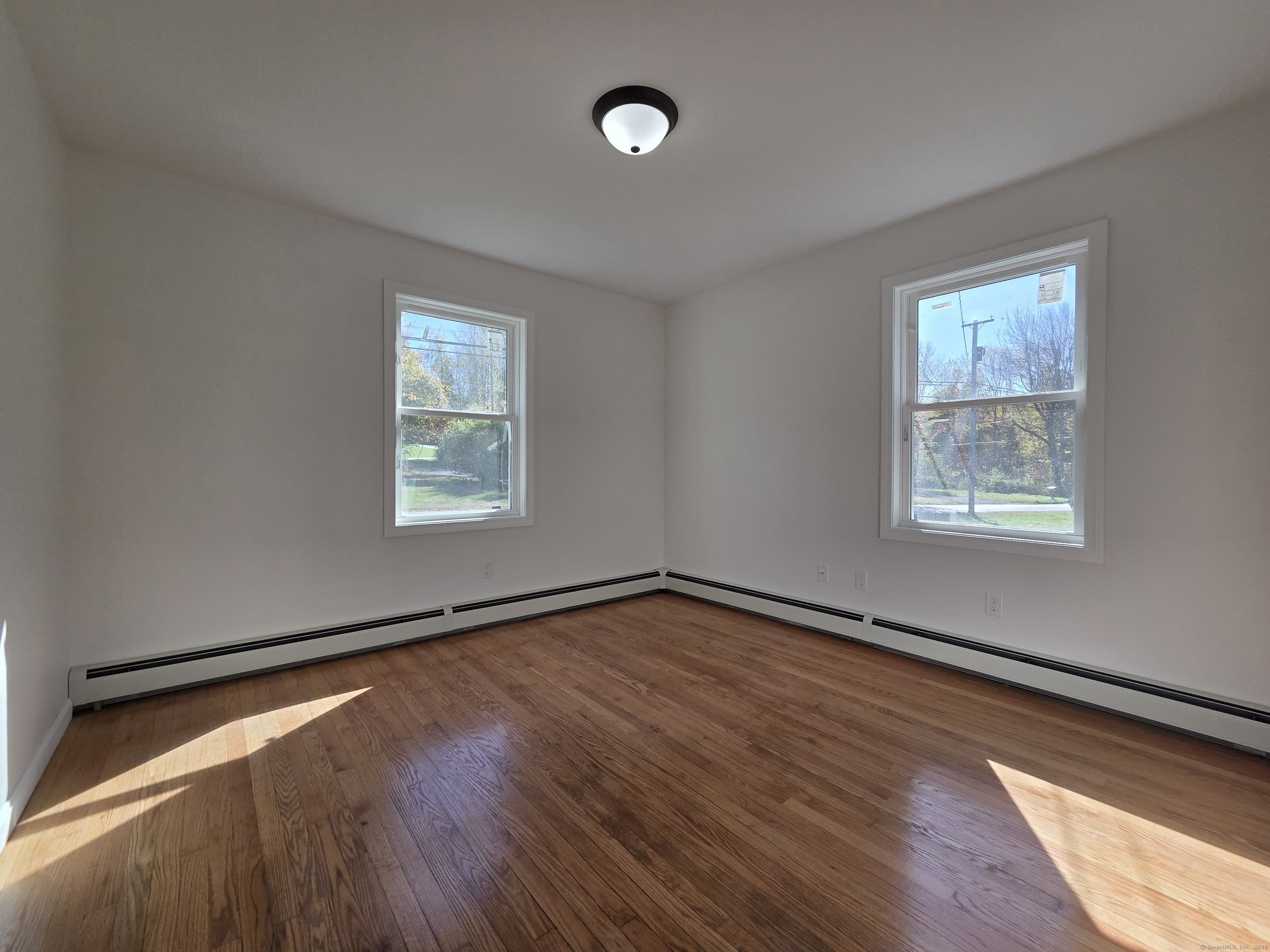 395 Bailey Hill Road Killingly, CT 06239 - Photo 19 of 36 a view of a room with wooden floor and window