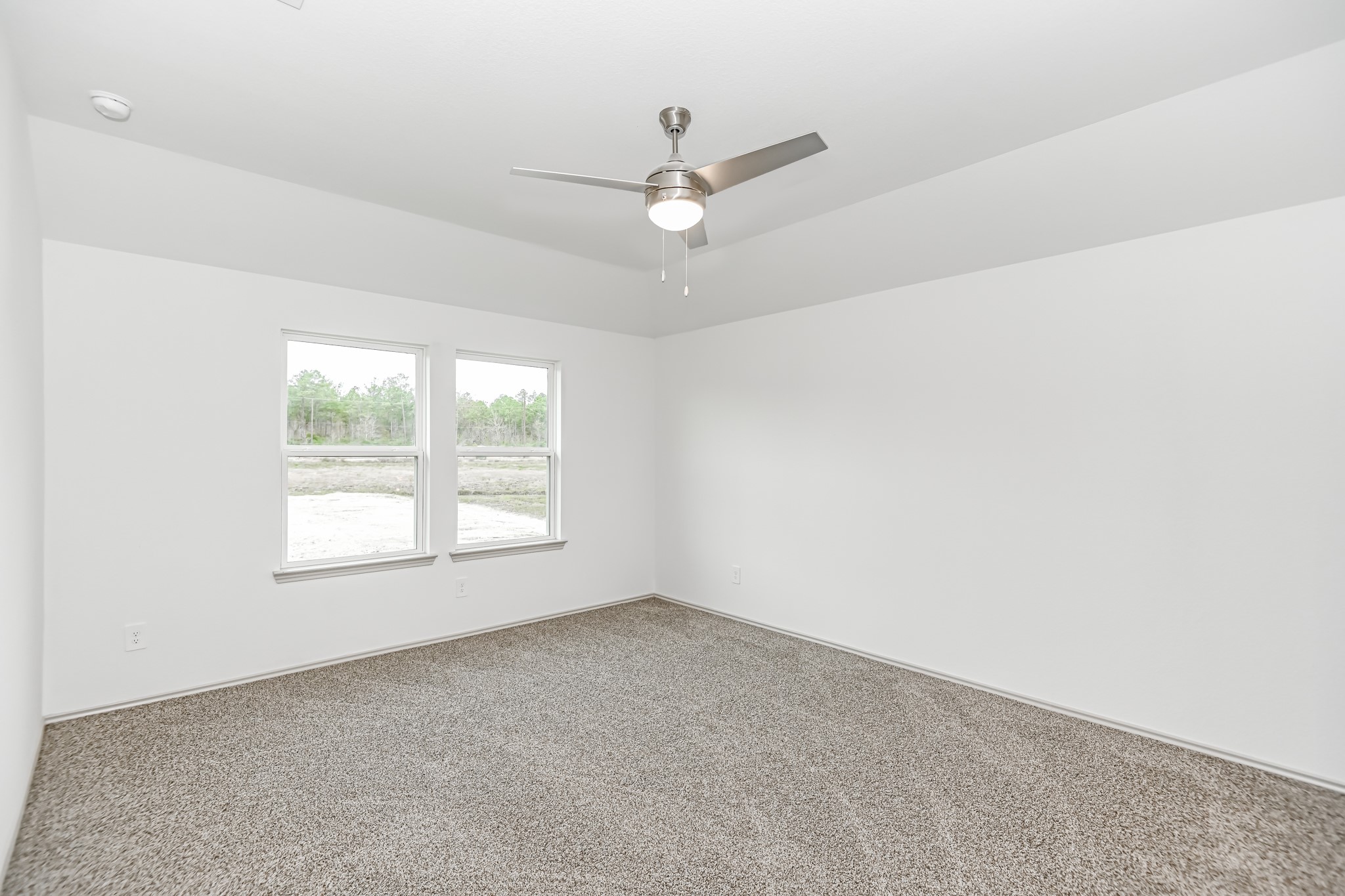 555 Hunter Grove Lane China, TX 77613 - Photo 14 of 21 an empty room with a window and a fan