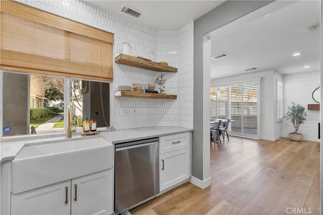 a view of a kitchen with appliances and furniture