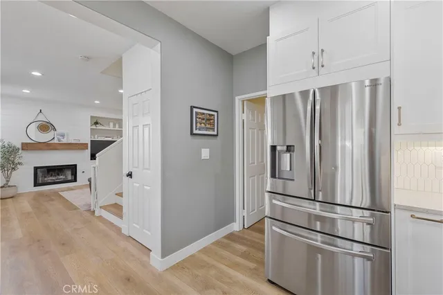 a view of kitchen with furniture and a refrigerator