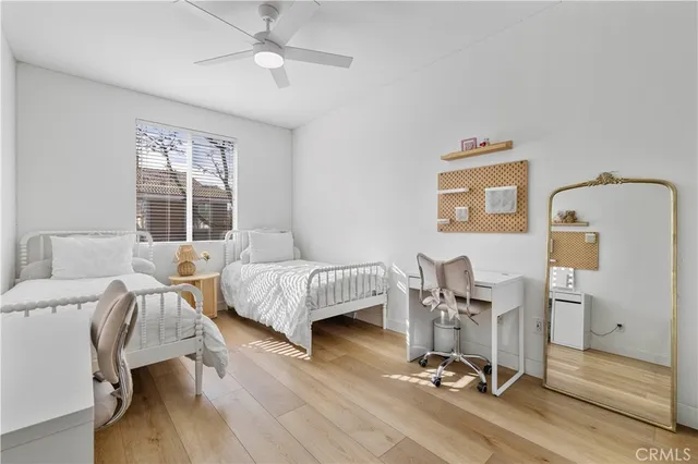 a bedroom with furniture and a window