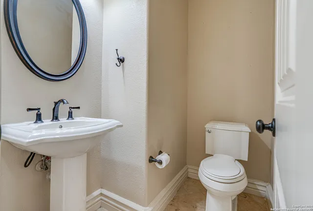 a bathroom with a sink and a toilet