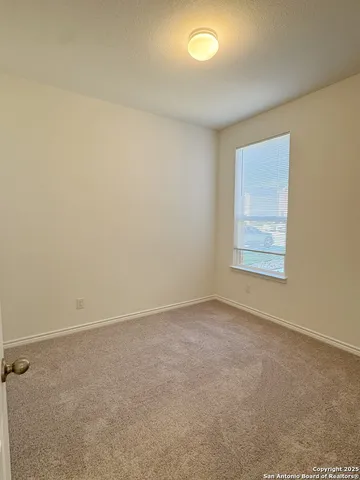 a bathroom with a bathtub and a toilet
