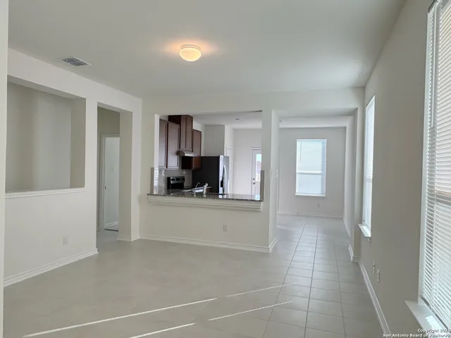 a view of a kitchen with a sink and dishwasher