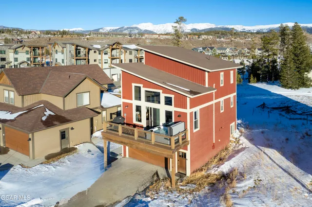 an aerial view of residential houses with wooden fence