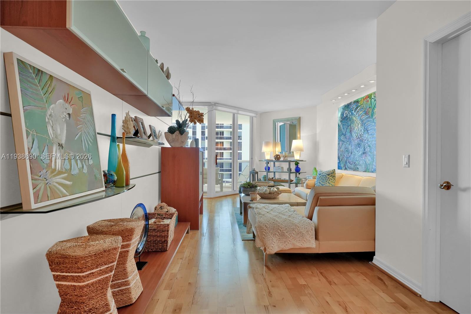 4779 Collins Avenue, Unit 3104 Miami Beach, FL 33140 - Photo 14 of 61 a living room with furniture and a large window