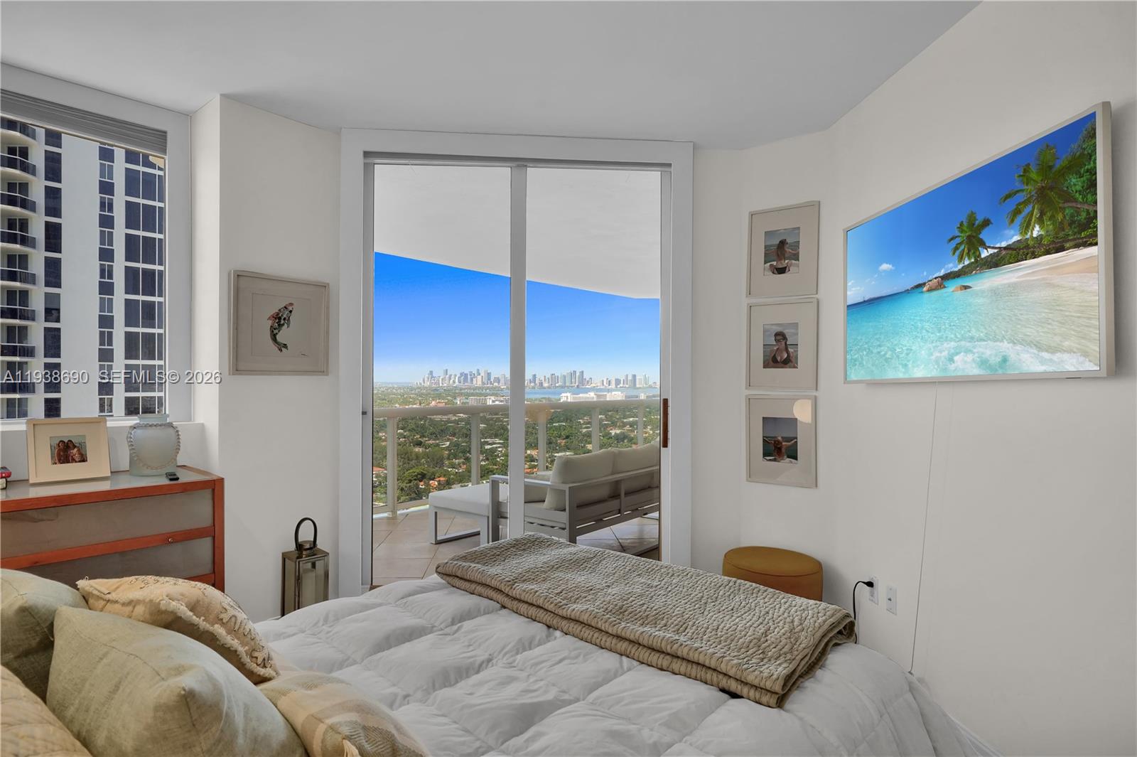 4779 Collins Avenue, Unit 3104 Miami Beach, FL 33140 - Photo 25 of 61 a bedroom with a bed and a large window