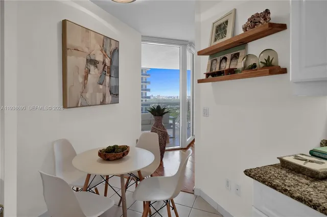 a view of walk in closet with clothes