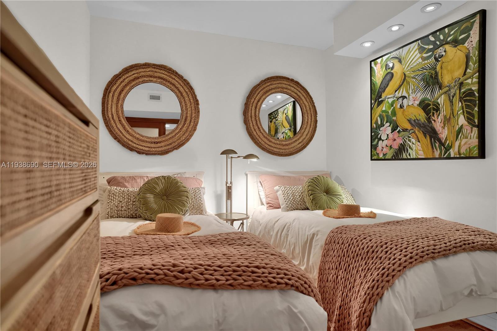 4779 Collins Avenue, Unit 3104 Miami Beach, FL 33140 - Photo 43 of 61 a bedroom with a bed and a painting on the wall