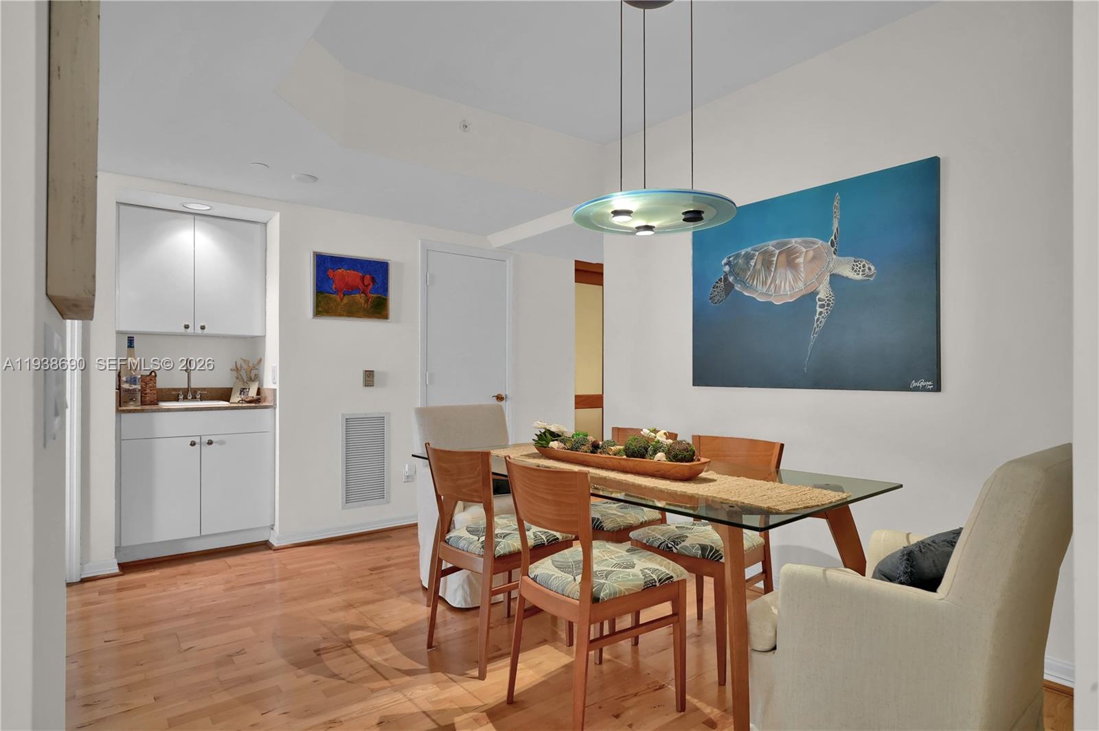 4779 Collins Avenue, Unit 3104 Miami Beach, FL 33140 - Photo 7 of 61 a dining room with furniture and window