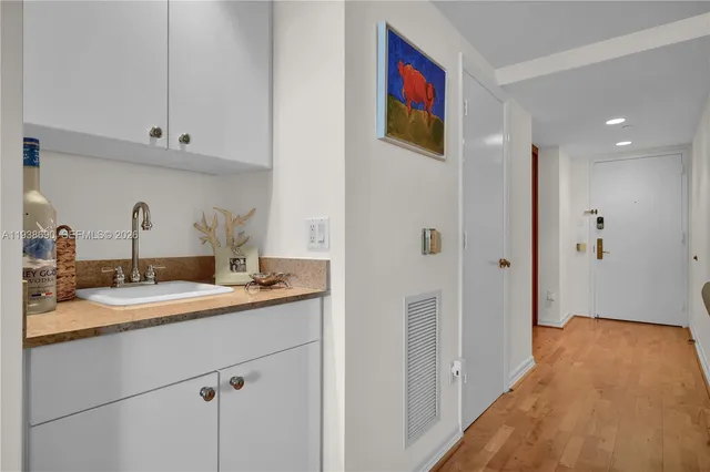 a en suite bathroom with a sink and mirror