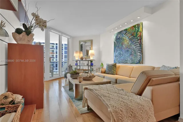 a living room with furniture and a large window