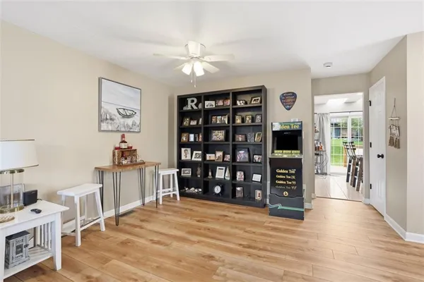 a view of a livingroom with furniture and wooden floor
