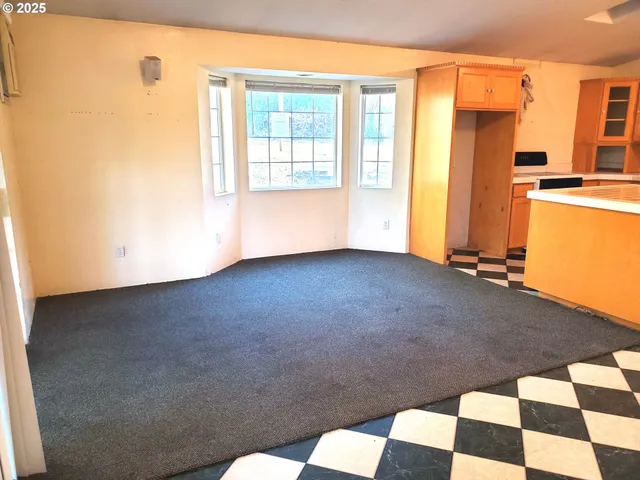 a view of a closet area with an empty room