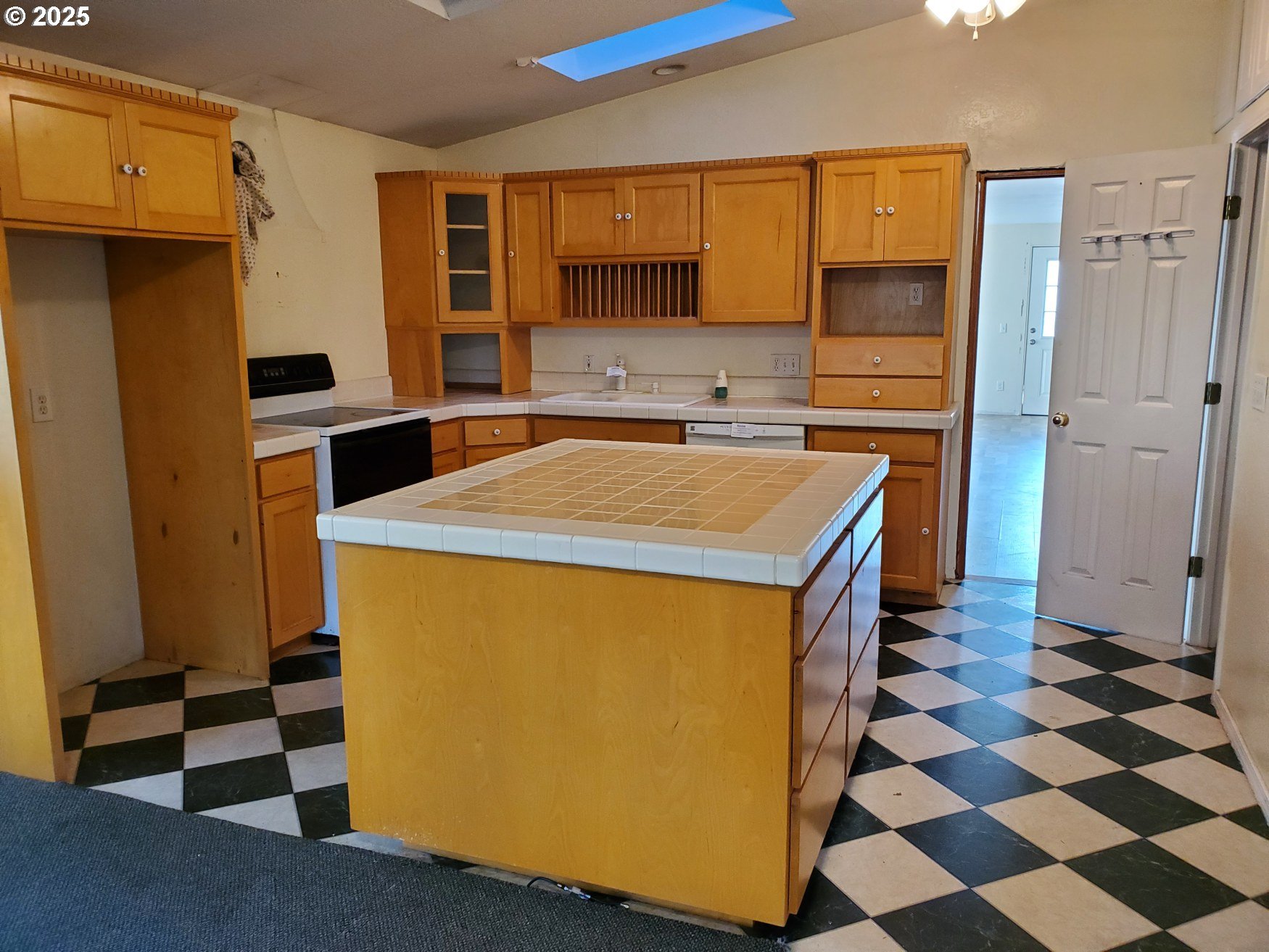 37186 Tree Farm Road Springfield, OR 97478 - Photo 25 of 37 a kitchen with stainless steel appliances a stove a sink and a refrigerator