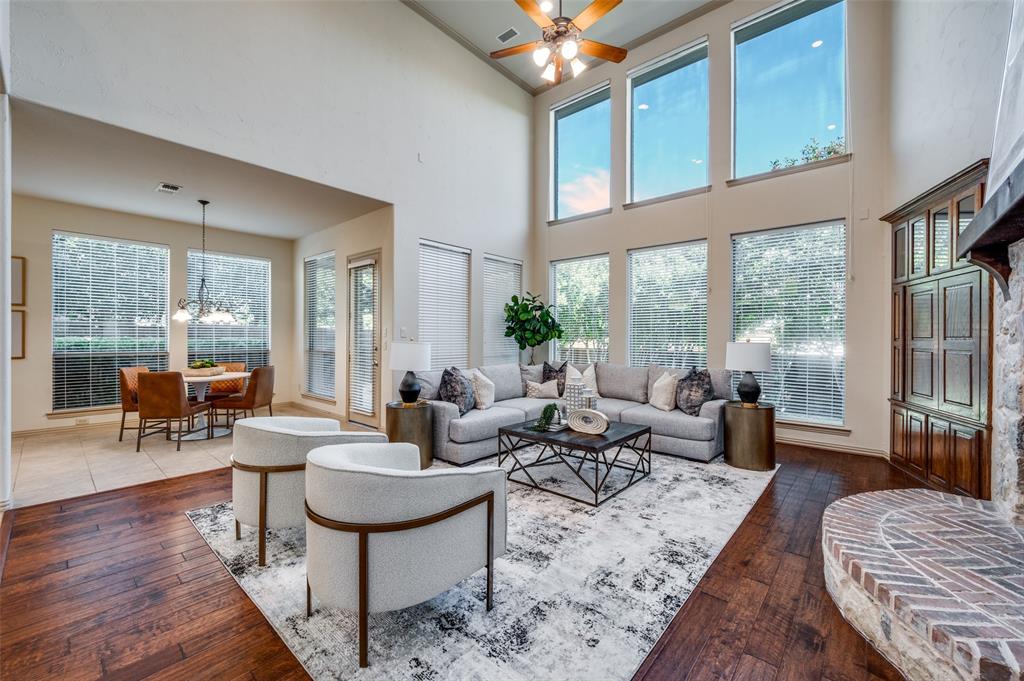 1318 Rio Grande Drive Allen, TX 75013 - Photo 11 of 38 a living room with furniture large windows and wooden floor
