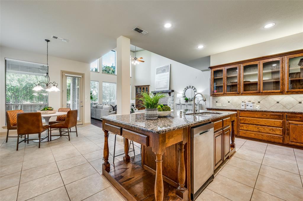 1318 Rio Grande Drive Allen, TX 75013 - Photo 16 of 38 a kitchen with stainless steel appliances granite countertop a stove a sink and a refrigerator