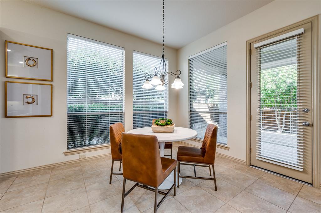 1318 Rio Grande Drive Allen, TX 75013 - Photo 18 of 38 a dining room with furniture large windows and wooden floor