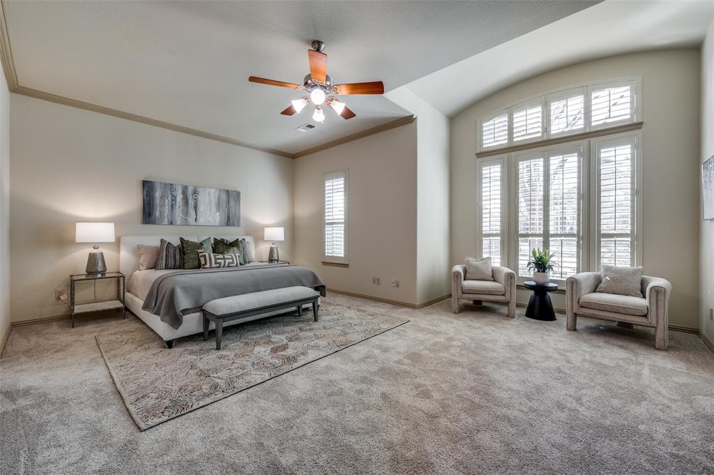1318 Rio Grande Drive Allen, TX 75013 - Photo 19 of 38 a spacious bedroom with a bed a couch and chandelier
