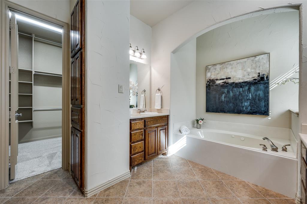 1318 Rio Grande Drive Allen, TX 75013 - Photo 20 of 38 a spacious bathroom with a tub sink and mirror